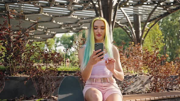 Teenager Looking at Phone Screen alt