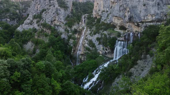Birds eye perspective of the Sotira waterfall in Albania. Aerial drone view. alt