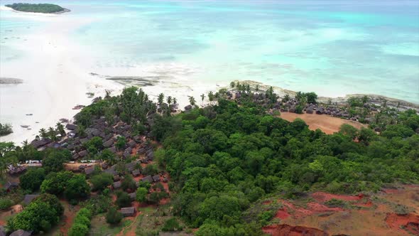 fly over of a tropical island village off Madagascar alt