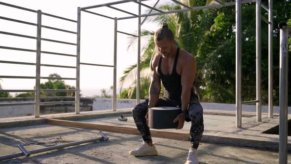Athletic Man Working Out at an Outdoor Gym. Strength and Motivation. alt
