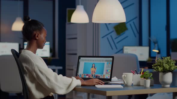 Dark Skin Freelancer Retoucher Woman Working Overtime on Laptop alt