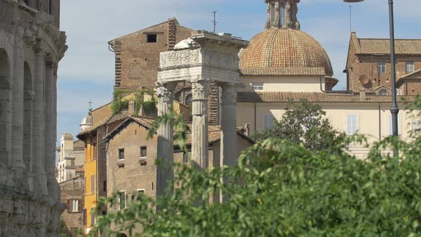 Ruined columns and church dome alt