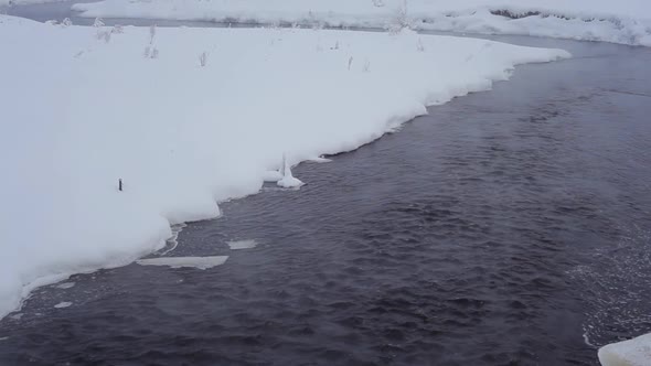 Winter River With Snowdrifts