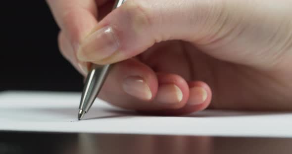 Close up of pen writing alt