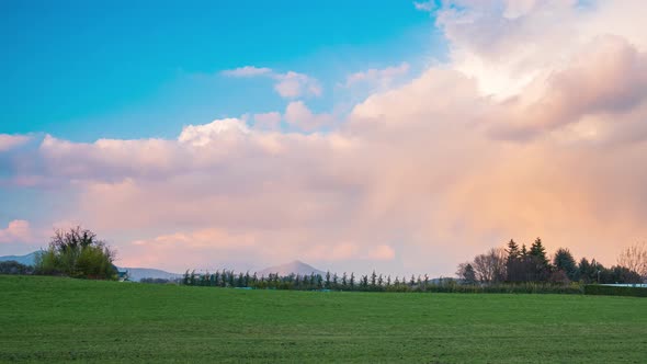 Time lapse: sunset over the Alps, unique scenery panoramic view alpine valley moving clouds, spring  alt