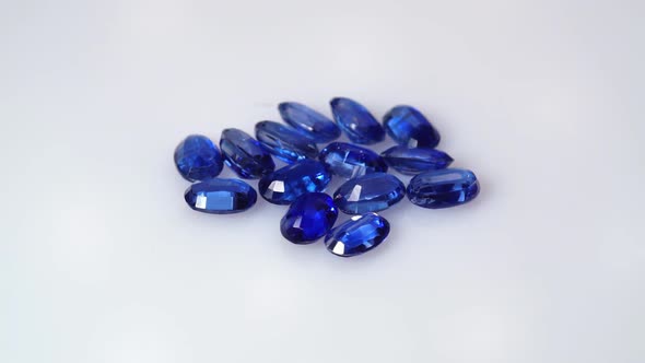 Natural Kyanite Gemstone on the White Background on the Turning Table alt