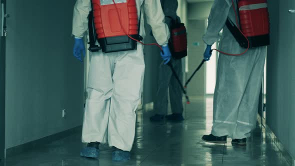 Coronavirus Pandemic, Virus Prevention, COVID-19 Concept. Group of Sanitary Experts Spraying alt