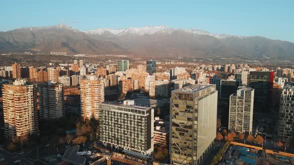 Panoramic Cityscape Of Las Condes In Santiago, Chile With Picturesque View Of The Andes Mountain Ran alt