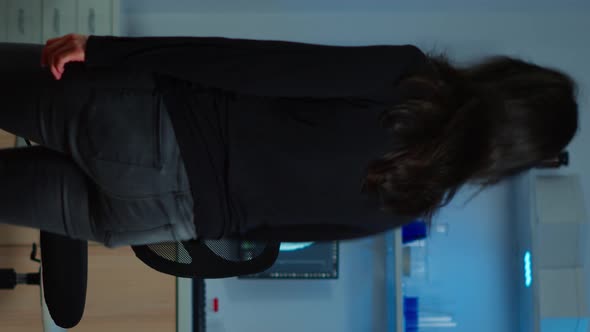 Vertical Video Wired Patient Waiting Scientist Doctor in Neurological Research Lab alt