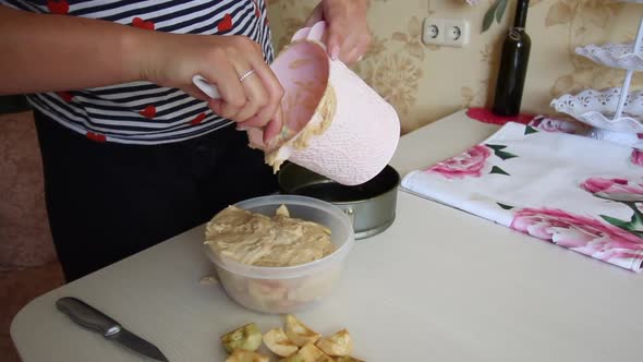 A Woman Lays Out The Dough For An Apple Pie. Cooking Charlotte At Home.
