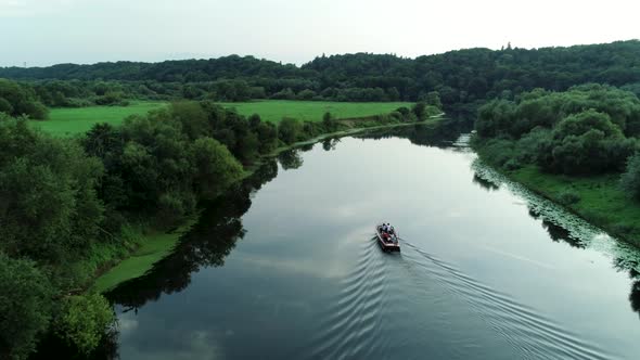 Aerial View Of Boat Sailing In Jungle River