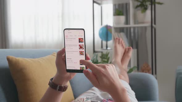 Close Up Of Hand Man Using Smartphone Buys In Internet Shop. Orders Food In An Online alt