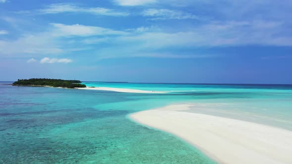 Aerial drone scenery of marine shore beach trip by blue sea with white sand background of a dayout n alt