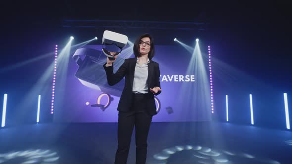 Host with Virtual Reality Glasses at Metaverse Event alt