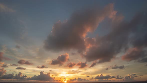 Time Lapse Sky Cloudskape With Red Clouds At Sunset. alt