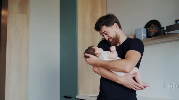 Happy and Sincere Facial Expression of Young Bearded Father While He Communicate with His Little alt