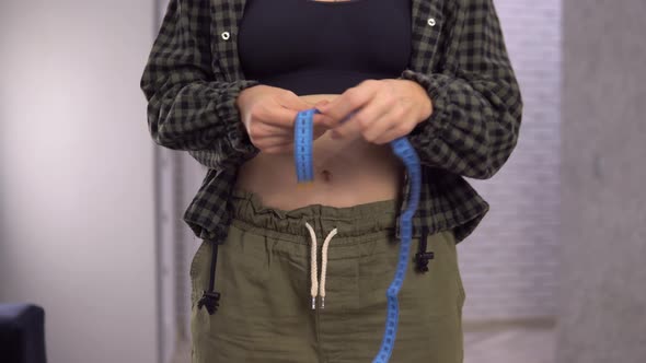 Overweight Fat Woman Measuring Waist