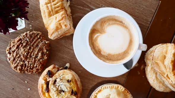 Breakfast with Croissants Pie Cookie and Cup of Coffee on Wooden Table in Cafe alt