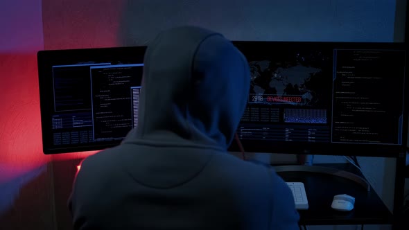 Unrecognizable Hacker Man Typing on Keyboard and Engaging Hacking Into Security Systems alt