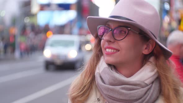 Girl At Time Square in New York alt