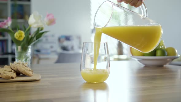 Filling Glass With Fresh Orange Juice