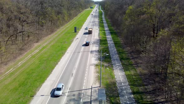 Fly above bicycle driveway with bicycle lane