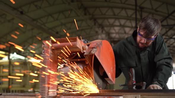 Metal Worker Grinding Iron With Electric Saw While Working. Slowmotion
