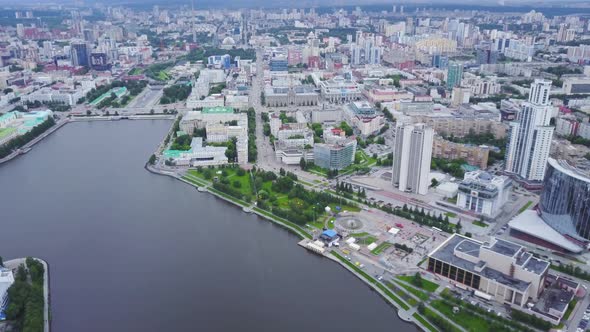 Top view of modern city with river in center alt