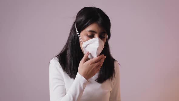 Sick Brunette Woman Cough in Surgical Mask Indoor. Distantly Self-isolating Having Coronavirus Flu
