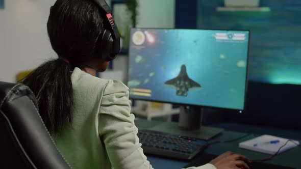 Excited African Gamer with Headphone Winning Important Online Game alt