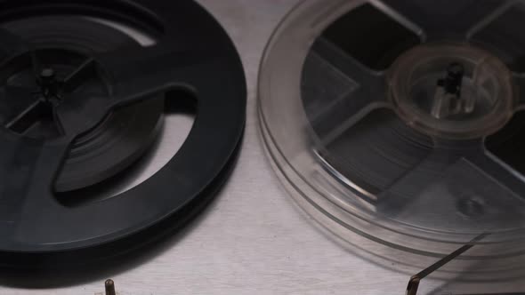 Extreme Close Up Shot of Spinning Reels on Old Analogue Reeltoreel Audio Tape Recorder alt