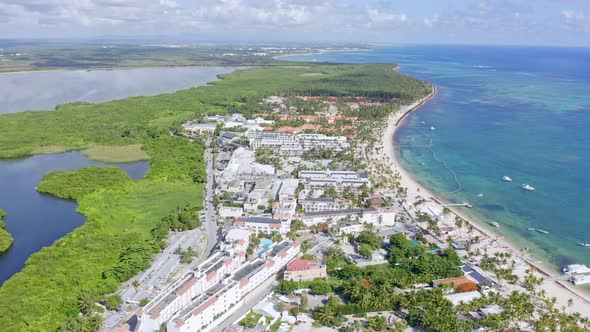 Stunning aerial view of luxury beachside resorts and Laguna Bavaro, Punta Cana alt
