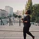 Side View Portrait of Young Overweight African American Woman Jogging Alone in Urban Park Practicing - VideoHive Item for Sale