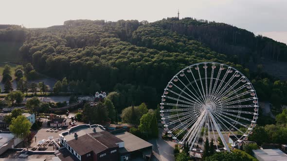 Drone View of Countryside with Ferris Wheel in the Hills in Sunny Weather