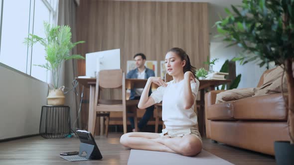 young asian female wife train yoga exercise workout practicing from online study lesson alt