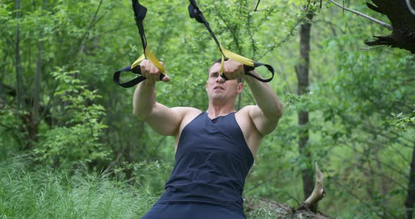 Athletic Man Using Sport Slings alt