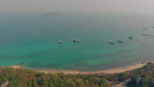 Motorboats Drift on Calm Ocean Water at Beach Aerial View alt