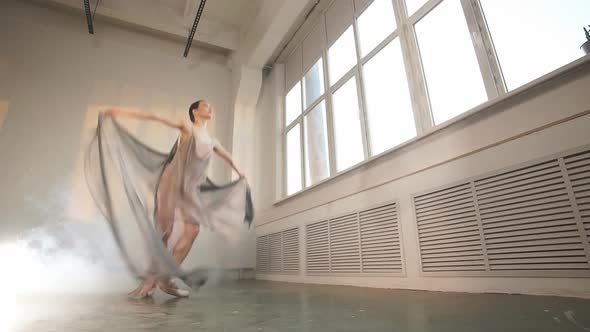 Flexible Ballet Dancer Stretching in the Dark Lighted Studio, Slow Motion alt