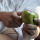 the Girl Sexually Cuts an Apple with a Knife Lying with Bare Legs - VideoHive Item for Sale