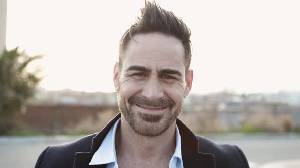 Confident Middle Age Man Looking at Camera Outdoors alt