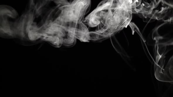 Cigarette Fume in Against Black Background alt