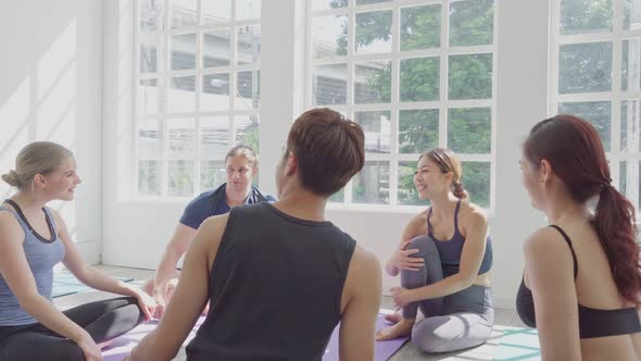 Group of diversity people talking and sharing story in yoga class