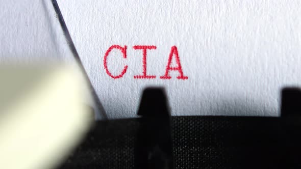 Typing "CIA KGB" on an old electric typewriter