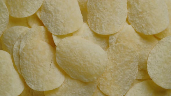 Top view potato chips rotation, close up.