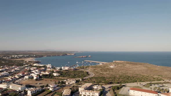 Drone shot overlooking at Porto de Pesca da Baleeira port and Praia da Baleeira beach Sagres alt