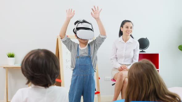 Caucasian beautiful woman teacher teaching a lesson to kid at school. alt