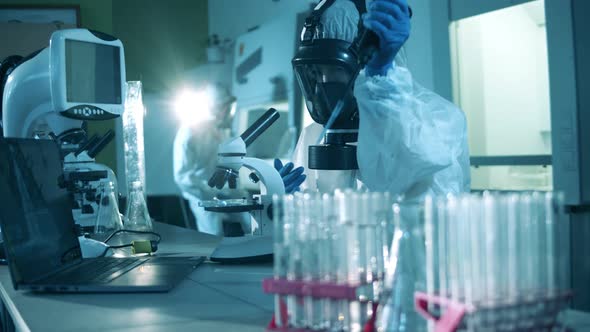 People Work in Laboratory with Coronavirus Tests. Covid19, Coronavirus Concept. Slow Motion. alt