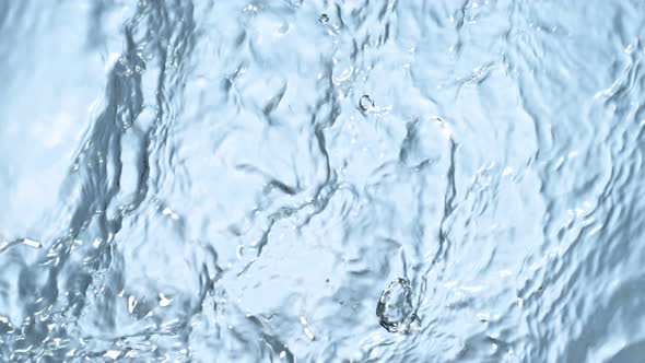 Super Slow Motion Abstract Shot of Rippling Blue Water Background at 1000Fps alt