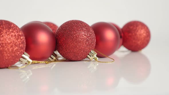 Zooming in Christmas baubles on white 4K  footage