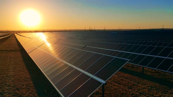 Drone Shot of a Photovoltaic Power Station at Sunset alt